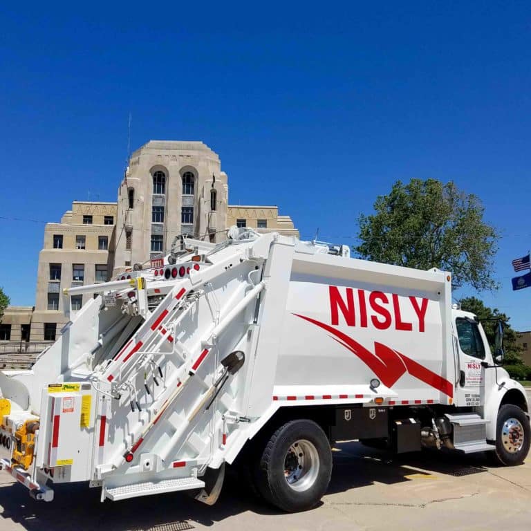 nisly brothers waste management service truck in city
